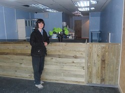 sarah leant on new rustic counter with rustic gate