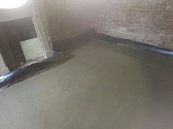 concreted slab over underfloor heating pipes, float up when part cured post flood refurb