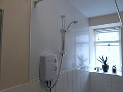 Rented property install hygeinic cladding to wall and new shower unit 