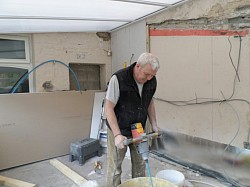 Me mixing and boarding prior to plastering.