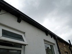 Not a very good picture but wooden gutter replaced with composite rotfree gutter