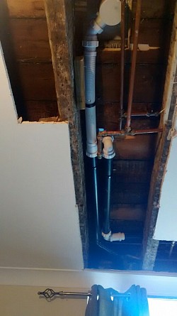 Pipework for shower redone going directly through wall with fall , minimum bends to soil stack
