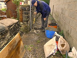 Dig and concrete in washing line post for retired couple