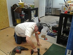Landlords request to board floor with 10mm ply to give good surface for glueing rubber floor with no disruption to underfloor carpet