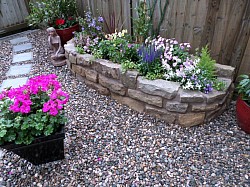 rustic sandstone flower bed 