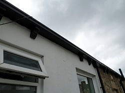 Not a very good picture but wooden gutter replaced with composite rotfree gutter