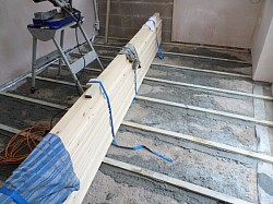 Uneven screed floor battened and levelled.floorboards acclimatising then secret nailed to battens